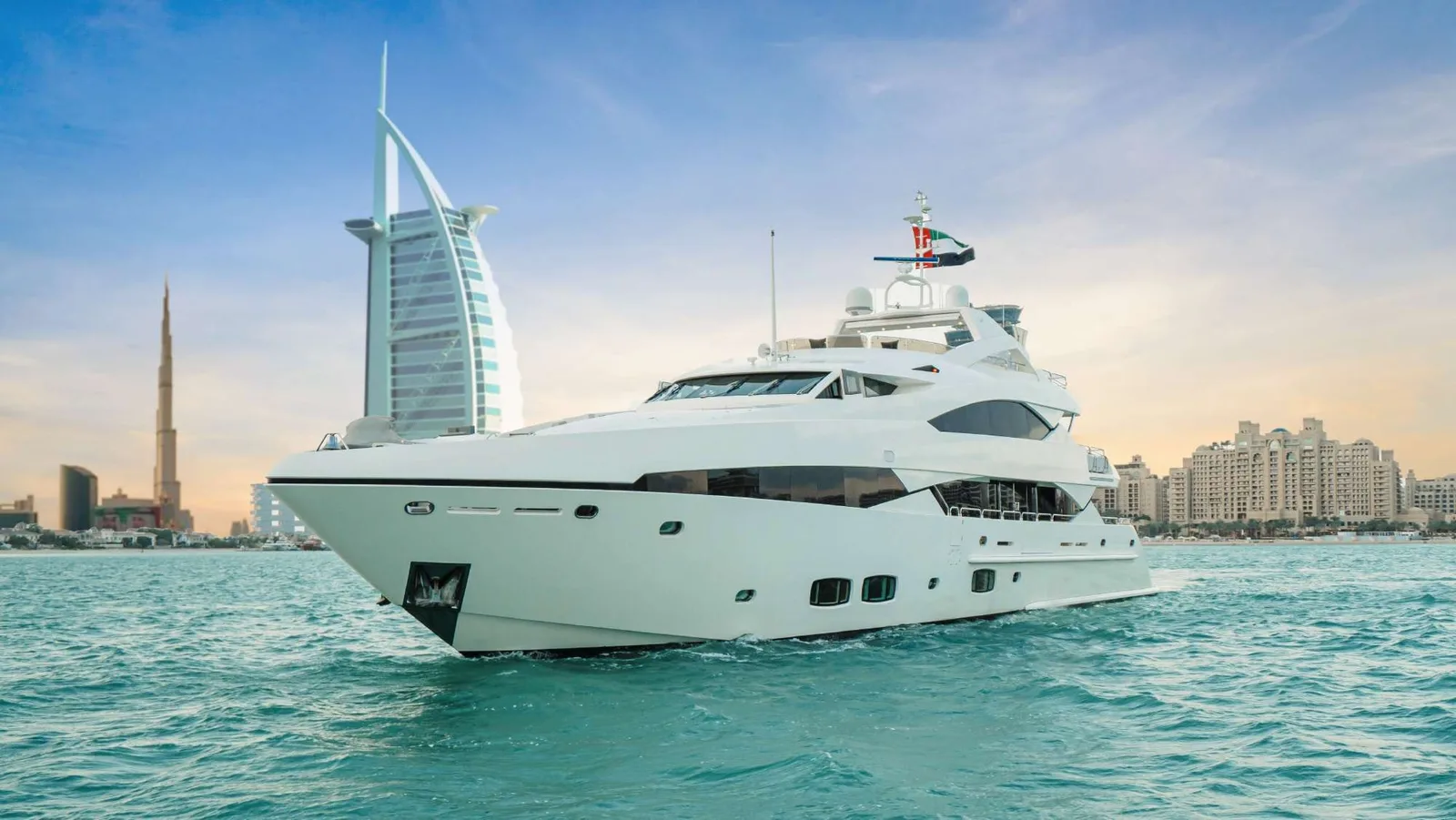 131 FT LUCIEN super yacht cruising beside Dubai skyline